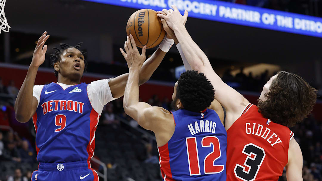 Feb 2, 2025; Detroit, Michigan, USA; Detroit Pistons forward Ausar Thompson (9) grabs the rebound over forward Tobias Harris (12) and Chicago Bulls guard Josh Giddey (3) in the first half at Little Caesars Arena. Mandatory Credit: Rick Osentoski-Imagn Images