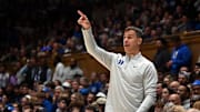 Nov 21, 2025; Durham, North Carolina, USA; Duke Blue Devils head coach Jon Scheyer directs his team during the second half against the Niagara Purple Eagles at Cameron Indoor Stadium. Mandatory Credit: Rob Kinnan-Imagn Images