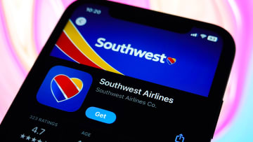 In this photo illustration, the Southwest Airlines logo is...