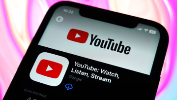 In this photo illustration, the YouTube logo is displayed in...