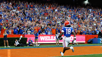 Aug 30, 2025; Gainesville, Florida, USA; Florida Gators defensive back Bryce Thornton (18) scores a touchdown against the Long Island Sharks during the first half at Ben Hill Griffin Stadium. Mandatory Credit: Matt Pendleton-Imagn Images