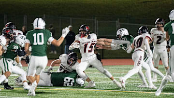 Nov 10, 2023; Franklin Lakes, NJ, USA; Northern Highlands at Ramapo in the NJSIAA North 1, Group 4 sectional final. NH #15 Chase Calarco tries to avoid a tackle in the first quarter.