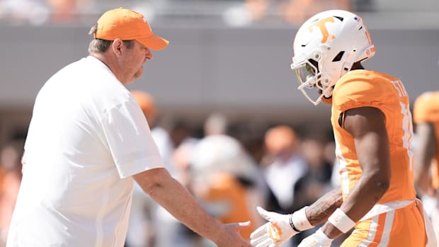 Josh Heupel high-fives a Tennessee player during the game against UAB.