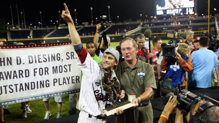 Former South Carolina baseball second baseman Scott Wingo posing with the College World Series trophy