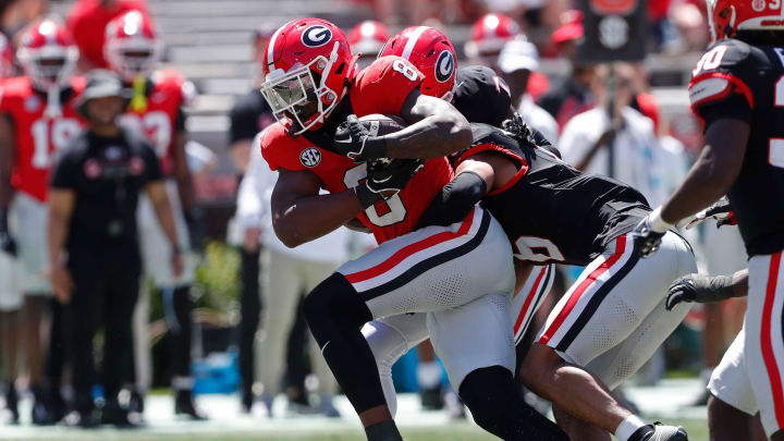 Georgia wide receiver Colbie Young (8) fights for extra yardage during the G-Day spring football game in Athens, Ga., on Saturday, April 13, 2024. The game ended in a tie.