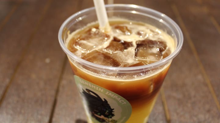 An iced coffee in a Genshin Impact-themed cup.