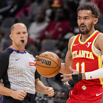 Apr 10, 2024; Atlanta, Georgia, USA; Atlanta Hawks guard Trae Young (11) handles the ball against the Charlotte Hornets during the first half at State Farm Arena. Mandatory Credit: Dale Zanine-Imagn Images