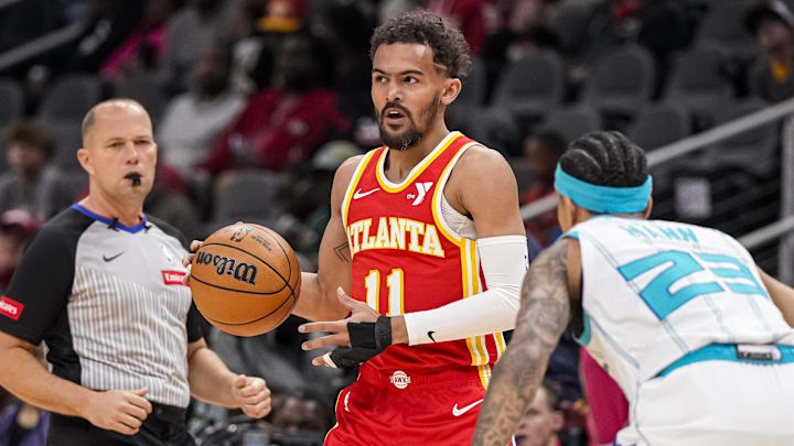 Apr 10, 2024; Atlanta, Georgia, USA; Atlanta Hawks guard Trae Young (11) handles the ball against the Charlotte Hornets during the first half at State Farm Arena. Mandatory Credit: Dale Zanine-Imagn Images