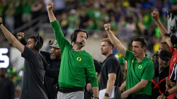 Oregon head coach Dan Lanning signals his team as the Oregon Ducks host the Boise State Broncos