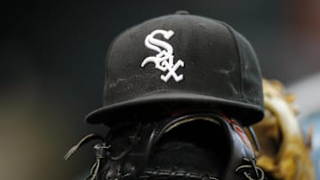 Detail view of a Chicago White Sox hat and glove on the bench before a game against the Houston Astros at Minute Maid Park. Mandatory Credit: Brett Davis-Imagn Images