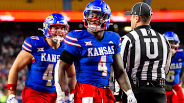 Nov 23, 2024; Kansas City, Missouri, USA;  Kansas running back Devin Neal (4) reacts after scoring a touchdown during the 3rd quarter between the Kansas Jayhawks and the Colorado Buffaloes at GEHA Field at Arrowhead Stadium. Mandatory Credit: Nick Tre. Smith-Imagn Images