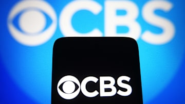 In this photo illustration, a CBS logo of a commercial...