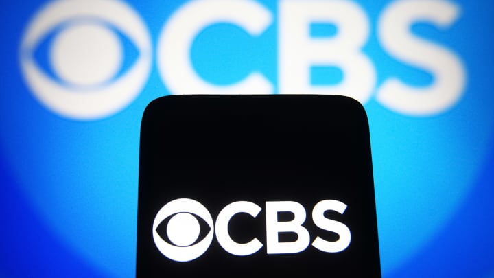 In this photo illustration, a CBS logo of a commercial...