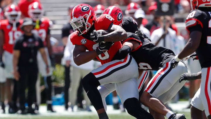 Georgia wide receiver Colbie Young (8) fights for extra yardage during the G-Day spring football game in Athens, Ga., on Saturday, April 13, 2024. The game ended in a tie.