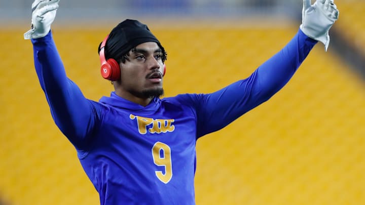 Nov 16, 2023; Pittsburgh, Pennsylvania, USA;  Pittsburgh Panthers defensive back A.J. Woods (9) warms up before the game against the Boston College Eagles at Acrisure Stadium. Mandatory Credit: Charles LeClaire-Imagn Images