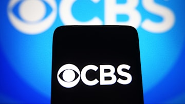In this photo illustration, a CBS logo of a commercial...