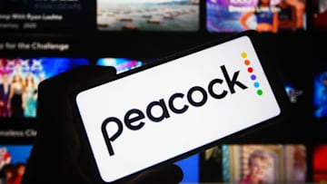 In this photo illustration a Peacock logo of an US video...