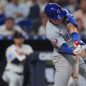 May 19, 2025; Miami, Florida, USA; Chicago Cubs third baseman Matt Shaw (6) hits a ground-rule double against the Miami Marlins during the sixth inning at loanDepot Park.