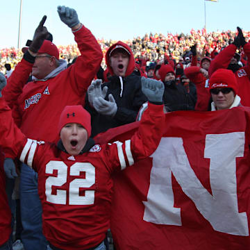 Husker fans cheer on Nebraska against the Iowa Hawkeyes.