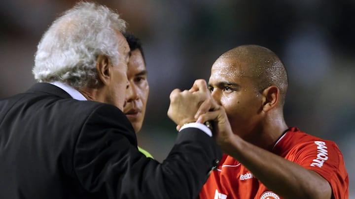 Internacional's Walter (R) celebrates wi