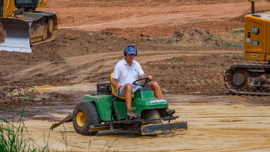 Gil Hanse on a green shaper at Baltusrol.