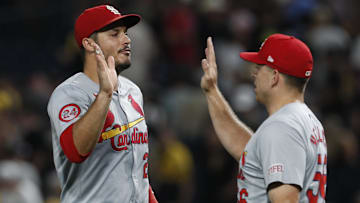 Jul 23, 2024; Pittsburgh, Pennsylvania, USA;  St. Louis Cardinals third baseman Nolan Arenado (28) and relief pitcher Ryan Helsley (56) celebrate after defeating the Pittsburgh Pirates at PNC Park. St. Louis won 2-1. Mandatory Credit: Charles LeClaire-Imagn Images