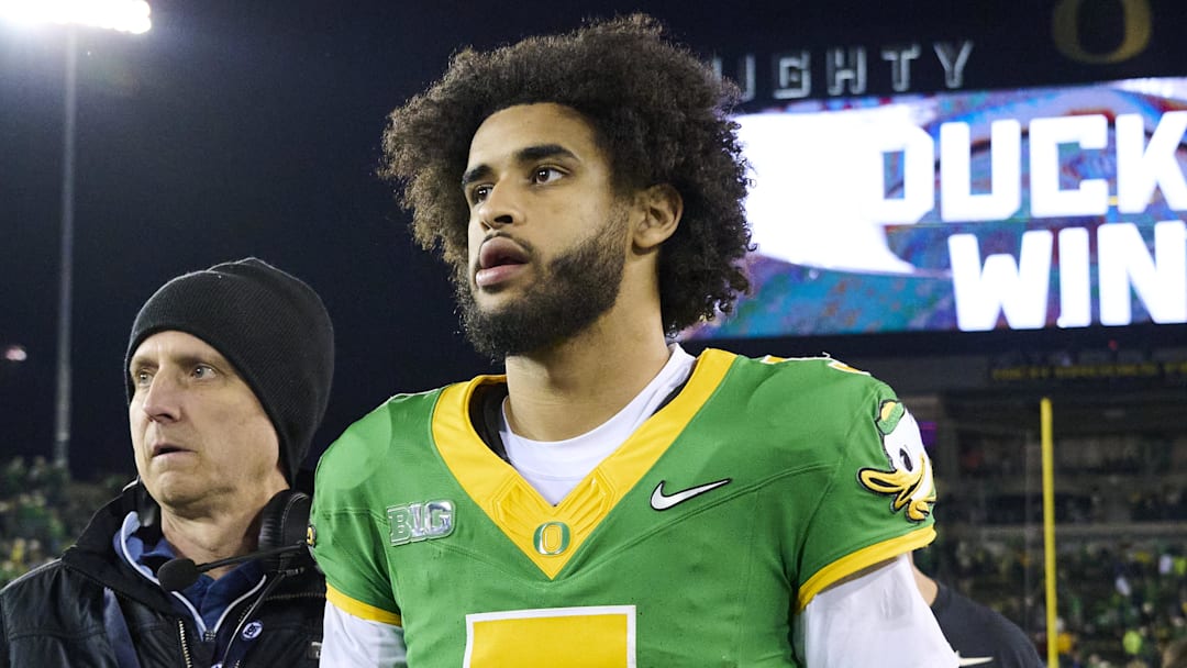 Nov 14, 2025; Eugene, Oregon, USA; Oregon Ducks quarterback Dante Moore (5) walks off the field after a game against the Minnesota Golden Gophers at Autzen Stadium. Mandatory Credit: Troy Wayrynen-Imagn Images