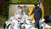 Oregon head coach Dan Lanning, and assistant coach A’Lique Terry walk the field during practice with the Oregon Ducks Tuesday, April 16, 2024 at the Hatfield-Dowlin Complex in Eugene, Ore.