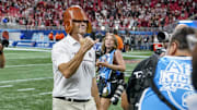 Aug 31, 2025; Atlanta, Georgia, USA; South Carolina Gamecocks head coach Shane Beamer wears the Old Leather Helmet after defeating the Virginia Tech Hokies at Mercedes-Benz Stadium. Mandatory Credit: Dale Zanine-Imagn Images