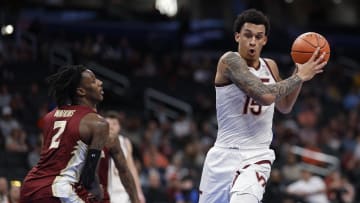 Mar 13, 2024; Washington, D.C., USA; Virginia Tech Hokies center Lynn Kidd (15) drives to the basket as Florida State Seminoles forward Jamir Watkins (2) defends in the first half at Capital One Arena. Mandatory Credit: Geoff Burke-USA TODAY Sports