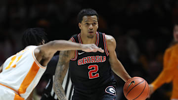 Jan 15, 2025; Knoxville, Tennessee, USA; Georgia Bulldogs guard De'Shayne Montgomery (2) dribbles against Tennessee Volunteers guard Jordan Gainey (11) during the second half at Thompson-Boling Arena at Food City Center. Mandatory Credit: Randy Sartin-Imagn Images