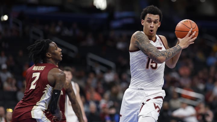 Mar 13, 2024; Washington, D.C., USA; Virginia Tech Hokies center Lynn Kidd (15) drives to the basket as Florida State Seminoles forward Jamir Watkins (2) defends in the first half at Capital One Arena. Mandatory Credit: Geoff Burke-USA TODAY Sports