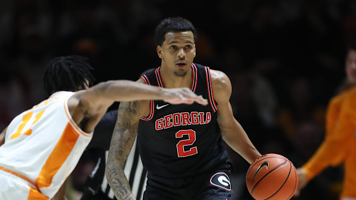 Jan 15, 2025; Knoxville, Tennessee, USA; Georgia Bulldogs guard De'Shayne Montgomery (2) dribbles against Tennessee Volunteers guard Jordan Gainey (11) during the second half at Thompson-Boling Arena at Food City Center. Mandatory Credit: Randy Sartin-Imagn Images