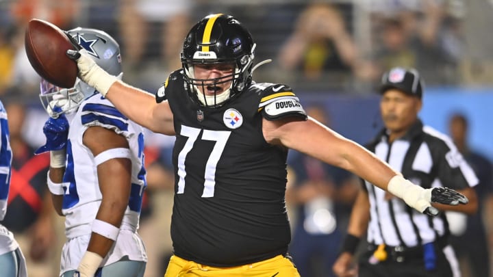 Aug 5, 2021; Canton, Ohio, USA; Pittsburgh Steelers offensive guard John Leglue (77) spikes the ball after a touchdown by running back Kalen Ballage (not pictured) against the Dallas Cowboys during the second half at Tom Benson Hall of Fame Stadium. Mandatory Credit: Ken Blaze-USA TODAY Sports