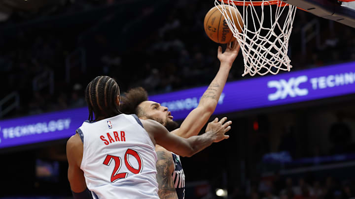 Dec 5, 2024; Washington, District of Columbia, USA; Dallas Mavericks center Dereck Lively II (2) shoots the ball as Washington Wizards forward Alexandre Sarr (20) defends in the second quarter at Capital One Arena. Mandatory Credit: Geoff Burke-Imagn Images Dec 5, 2024; Washington, District of Columbia, USA; Dallas Mavericks center Dereck Lively II (2) shoots the ball as Washington Wizards forward Alexandre Sarr (20) defends in the second quarter at Capital One Arena. Mandatory Credit: Geoff Burke-Imagn Images