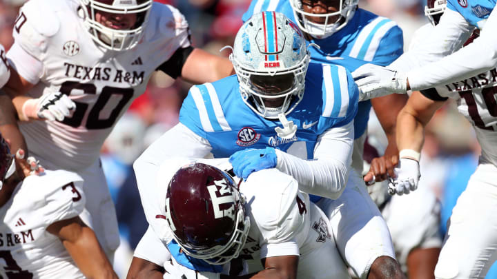 Nov 4, 2023; Oxford, Mississippi, USA; Mississippi Rebels defensive linemen Zxavian Harris (51) tackles Texas A&M Aggies running back Amari Daniels (4) during the second half at Vaught-Hemingway Stadium. Mandatory Credit: Petre Thomas-USA TODAY Sports