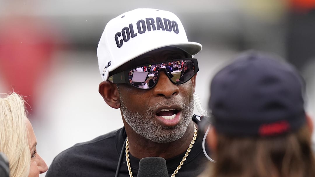 Oct 11, 2025; Boulder, Colorado, USA; Colorado Buffaloes head coach Deion Sanders is interviewed by ESPN during a time out in the first quarter against the Iowa State Cyclones at Folsom Field.