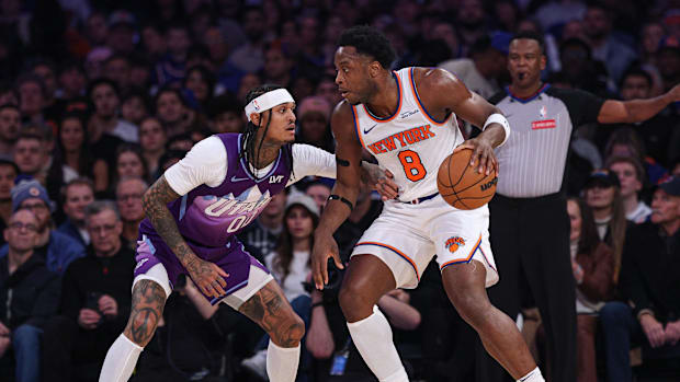 New York Knicks forward OG Anunoby (8) is guarded by Utah Jazz guard Jordan Clarkson (00) during the first half at Madison
