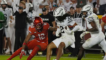 Iowa State Cyclones' defensive back Jamison Patton (2) runs with the ball after an interception around Arizona Wildcats defensive back Genesis Smith (12) during the fourth quarter in the Big-12 conference showdown on Sept. 27, 2025, at Jack Trice Stadium in Ames, Iowa.