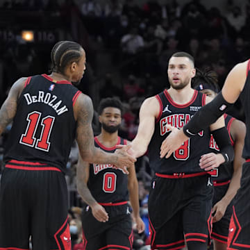 Chicago Bulls guard Zach LaVine (8), forward DeMar DeRozan (11) and center Nikola Vucevic (9).