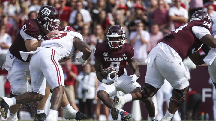 Oct 7, 2023; College Station, Texas, USA; Texas A&M Aggies running back Le'Veon Moss (8) runs with the ball during the second quarter against the Alabama Crimson Tide at Kyle Field. Mandatory Credit: Troy Taormina-USA TODAY Sports