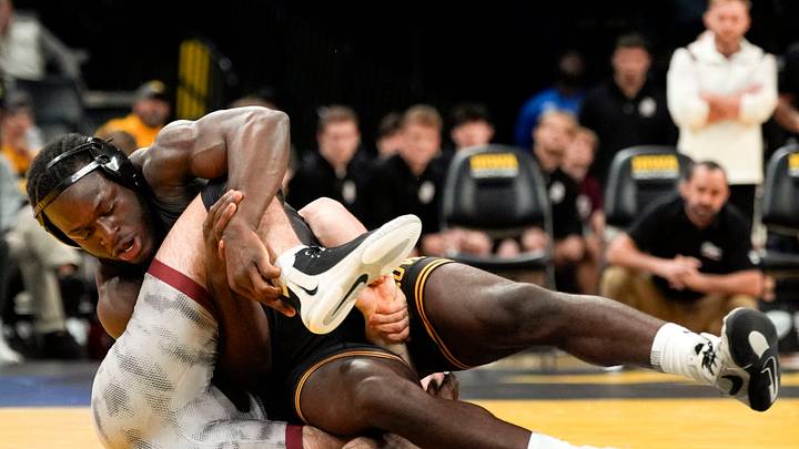 Iowa’s Massoma Endene wrestles Bellarmine’s Andrew Liber in a 197-pound match Nov. 6, 2025 at Carver-Hawkeye Arena in Iowa City, Iowa.