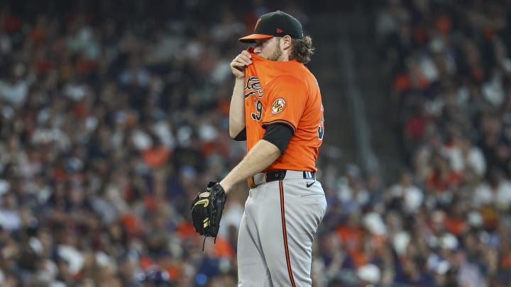 Jun 22, 2024; Houston, Texas, USA; Baltimore Orioles starting pitcher Corbin Burnes reacts after a pitch.