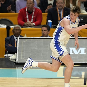 Apr 5, 2025; San Antonio, TX, USA; Duke Blue Devils guard Kon Knueppel (7) reacts after a play against the Houston Cougars during the first half in the semifinals of the men's Final Four of the 2025 NCAA Tournament at Alamodome. Mandatory Credit: Scott Wachter-Imagn Images