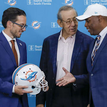 Miami Dolphins head coach Mike McDaniel, shakes hands with general manager Chris Grier and owner Stephen M. Ross after a press conference at Baptist Health Training Center back in February 2022.