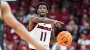 Louisville Cardinals guard Kobe Rodgers (11) brings up the ball as the Cards take on Eastern Michigan Nov. 24, 2025 at the KFC Yum! Center in Louisville, Kentucky.