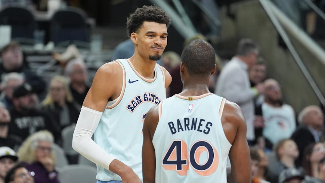 Dec 8, 2024; San Antonio, Texas, USA;  San Antonio Spurs center Victor Wembanyama (1) and forward Harrison Barnes (40) in the second half against the New Orleans Pelicansn at Frost Bank Center. Mandatory Credit: Daniel Dunn-Imagn Images