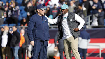 Dec 29, 2019; Foxborough, Massachusetts, USA; Miami Dolphins head coach Brian Flores talks with New