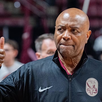Florida State Seminoles head coach Leonard Hamilton gives a thumbs up to the crowd as he walks onto the court for warmups. The Florida State Seminoles lead the Southern Methodist Mustangs 33-32 at the half on Saturday, March 8, 2025.