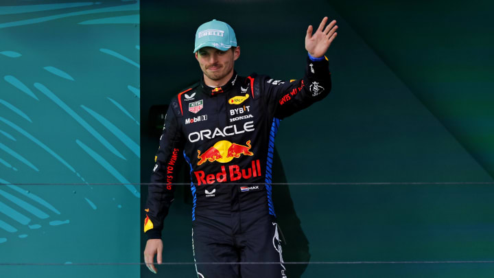 May 5, 2024; Miami Gardens, Florida, USA; Red Bull Racing driver Max Verstappen (1) celebrates on the podium after winning third place in the Miami Grand Prix at Miami International Autodrome. Mandatory Credit: Peter Casey-USA TODAY Sports